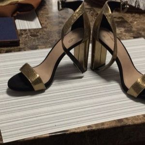 Gold and black ankle strap shoe
